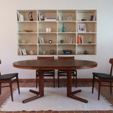 Table ronde extensible Farstrup en palissandre années 70, pied central étoile, fabrication danoise, jusqu'à 10 couverts avec rallonge