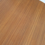 Table à manger ronde extensible vintage en teck miel, pieds fuseau, deux rallonges jusqu'à douze couverts, style scandinave fabrication française années 60