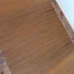 Table à manger ronde extensible vintage en teck miel, pieds fuseau, deux rallonges jusqu'à douze couverts, style scandinave fabrication française années 60