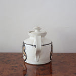 Théière grès émaillé artisanal années 70, décor peint main trèfle quatre feuilles, blanc cassé moucheté brun doré, liseré noir col, tournée main